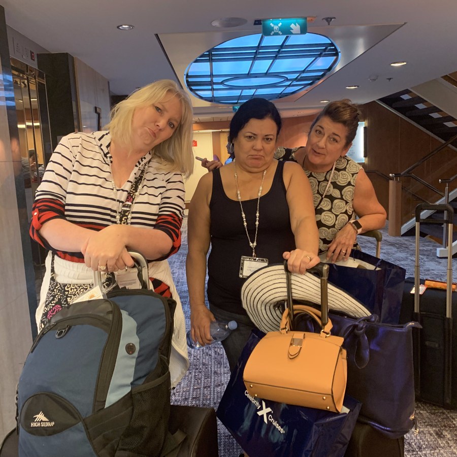 Michelle and friends wrangling luggage after a cruise